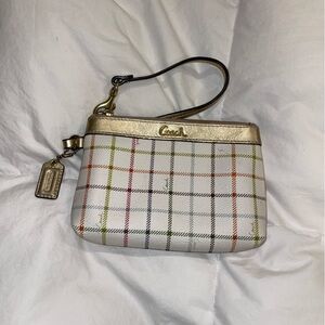 Small stripped coach wristlet